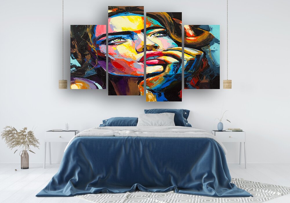 Bedroom interior with a blue bedspread against a white wall back